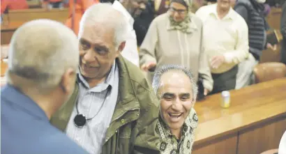  ??  ?? JOY. Ahmed Timol’s younger brother Mohamed Timol, right, Essop Pahad, centre, and Imtiaz Cajee celebrate after Judge Billy Mothle’s judgment on the inquest.