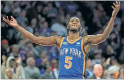  ?? Corey Sipkin ?? BIG NIGHT! Immanuel Quickley, who finished with 20 points, reacts after Jalen Brunson hits a shot during the second half.