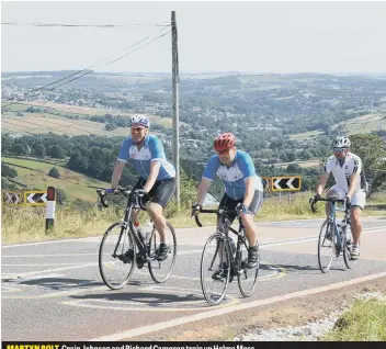  ??  ?? MARTYN BOLT, Craig Johnson and Richard Cameron train up Holme Moss