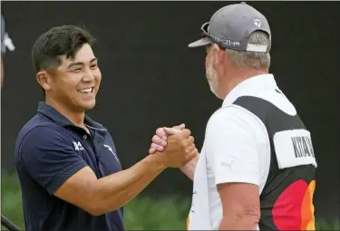  ?? JOHN RAOUX — THE ASSOCIATED PRESS ?? Kurt Kitayama, left, shakes hands with his caddie Tim Tucker after winning the Arnold Palmer Invitation­al on Sunday.