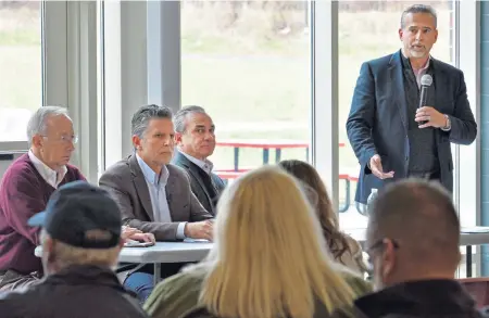  ??  ?? ‘WRITING THE BOOK AS THEY GO’: Pablo Vegas of Columbia Gas talks to residents at yesterday’s open house in North Andover.