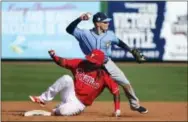  ?? DOUGLAS R. FLIFFORD — TAMPA BAY TIMES VIA AP ?? The Tampa Bay Rays’ Jake Bauers (70) attempts to turn a double play after forcing out the Phillies’ Hector Gomez at second during the ninth inning Monday in Clearwater, Fla.