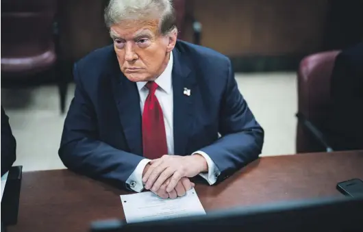  ?? JABIN BOTSFORD/THE WASHINGTON POST ?? Former president Donald Trump arrives in Manhattan criminal court with his legal team ahead of the start of jury selection on Monday.