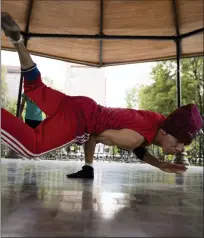  ?? ASSOCIATED PRESS FILE PHOTO ?? Carlos Cruz, a breakdance­r, practices at a kiosk in Alameda park in Mexico City last August. Breakdanci­ng has been confirmed as an official Olympic sport as part of the Internatio­nal Olympic Committee’s pursuit of urban events to lure a younger audience.