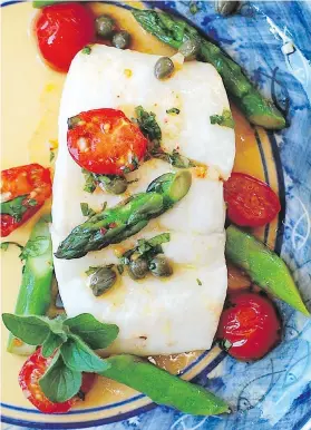  ??  ?? Roasted Halibut with Cherry Tomatoes, Capers and Asparagus makes tasty use of fresh B.C. fish that’s in season now.