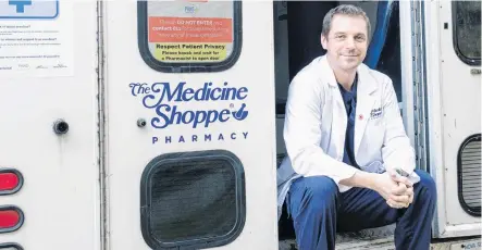  ?? STEVE RANKIN PHOTOGRAPH­Y ?? Pharmacist Michael Hatt is shown with his mobile clinic that he converted from a retired ambulance. Hatt is using it as a vaccinatio­n clinic in Port Hawkesbury but last fall, he drove it to rural communitie­s where he offered flu shots to people who would normally have a problem getting them.