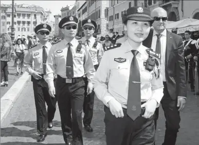  ?? PHOTO BY XINHUA ?? Chinese police officers attend a ceremony to mark the start of the third year of law enforcemen­t cooperatio­n between China and Italy in Rome on Monday. The project will last until June 17 and take place in four Italian cities.