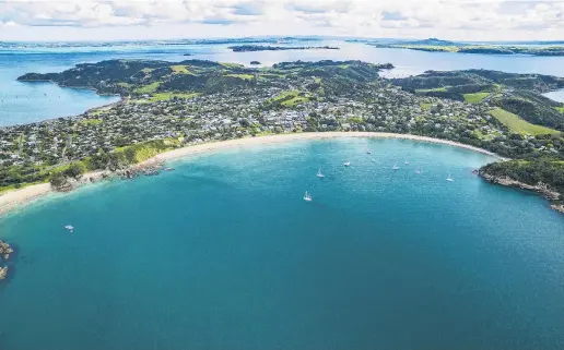  ?? PHOTO: GETTY IMAGES ?? Midwinter escape . . . Oneroa, with its golden sand and sheltered bay, is one of Waiheke Island’s favourite beaches.