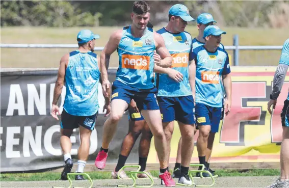  ??  ?? Will Brimson doing some running drills at Gold Coast Titans pre-season training. Picture: Nigel Hallett