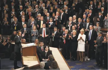  ?? Win McNamee / Getty Images ?? French President Emmanuel Macron reacts to a standing ovation after addressing the U.S. Congress.