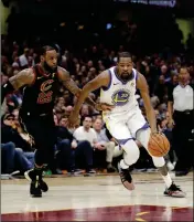  ?? ASSOCIATED PRESS ?? GOLDEN STATE WARRIORS’ Kevin Durant goes to the basket against Cleveland Cavaliers’ LeBron James during the first half of Friday’s game in Cleveland.