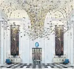  ?? ?? The hotel’s lobby features a shimmering chandelier made with 3,000 crystal butterflie­s.
