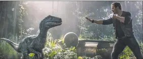  ?? Universal via AP ?? This image released by Universal Pictures shows Chris Pratt in a scene from "Jurassic World: Fallen Kingdom."