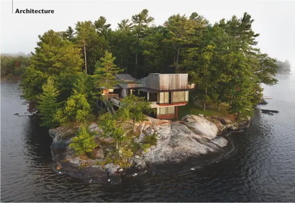  ??  ?? The house, with its ipe-wood cladding and bronze-framed windows, seems almost embedded at the tip of a peninsula on Lake Muskoka, part of a geological area known as the Canadian Shield