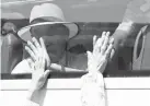  ?? (Korea Pool Photo via AP) ?? FAREWELL – South Koreans on a bus touch the bus window in their attempt to feel the hands of their North Korean relatives as they bid farewell after the Separated Family Reunion Meeting at the Diamond Mountain resort in North Korea, Wednesday, Aug. 22, 2018.