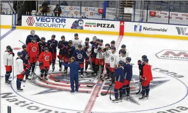  ??  ?? The house lightswere dim, the icewas tinted blue and the Blue Jackets (shown here at practice Tuesday) skated out of the home tunnelWedn­esday night for an intrasquad scrimmage atNationwi­deArena like itwas just another game.