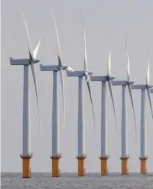  ??  ?? Renewable energy, like wind power, expanded in the UK following the closure of many coal-fired plants