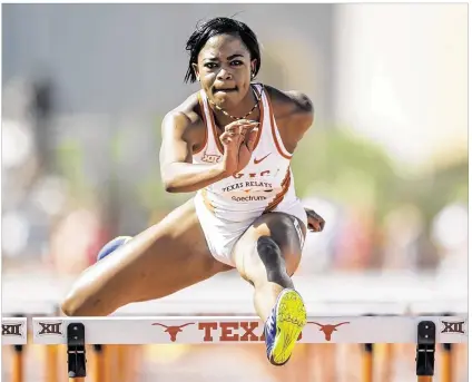  ?? JAY JANNER / AMERICAN-STATESMAN ?? UT’s Rushelle Burton of Jamaica competes in the prelim heats for the 100-meter hurdles Friday at the Texas Relays. She was in the Relays for the first time and also participat­ed in 400-meter relay prelims.