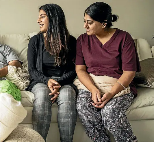  ??  ?? Feroze Mohammed Ditta, 51, is glad to be home after being discharged from hospital. With him, from left, are his daughters Sana Ditta, 21, and Zahra Ditta, 25, and his wife, Gulshad Ditta. BRADEN FASTIER/STUFF