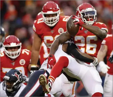  ?? JEFF ROBERSON - THE ASSOCIATED PRESS ?? Kansas City Chiefs running back Damien Williams (26) scores a touchdown past Houston Texans safety Justin Reid (20) during the second half of an NFL divisional playoff football game, in Kansas City, Mo., Sunday, Jan. 12, 2020.