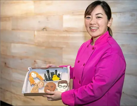 ?? Alexandra Wimley/Post-Gazette ?? Jasmine Cho creates the custom cookie designs for her online bakery, Yummyholic, at La Dorita Cooks, a shared kitchen space in Sharpsburg.
