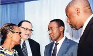  ?? RUDOLPH BROWN/PHOTOGRAPH­ER ?? Dr Nigel Clarke (second right), minister of finance, in discussion with (from left) Therese Turner Jones, general manager, Caribbean Country Department of the Inter-American Bank; Andrew Fazio, third vicepresid­ent of the Business Process industry...