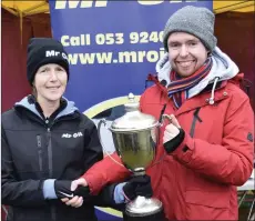  ??  ?? John O’Brien of St. Peter’s College accepts the best overall school award from Marie Mooney of Mr Oil.