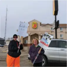  ?? ?? Two Super 8 Moose Jaw employees who have been locked out since March 3 are walking a picket line in protest against what they say are unfair labour practices and bad faith bargaining (photo by Gordon Edgar)