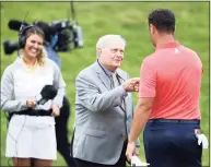  ?? Jamie Squire / Getty Images ?? Jack Nicklaus congratula­tes Jon Rahm on the 18th green after Rahm won during the final round of The Memorial Tournament on July 19 at Muirfield Village Golf Club in Dublin, Ohio.