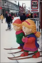  ?? (File Photo/AP/Michel Euler) ?? The wooden mascots of the Winter Olympics watch over one of the main shopping streets Feb. 8, 1994, in Lillehamme­r, Norway.