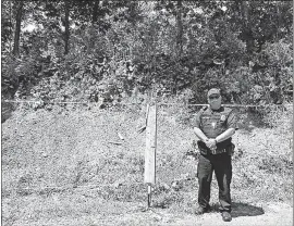  ?? [MARY BETH LANE/DISPATCH PHOTOS] ?? Baltimore Police Chief Michael Tussey stands along the rope line where targets are pinned when the Baltimore Police Department’s shooting range is in use in Fairfield County. Tussey plans to build the clay dirt backstop higher to address neighbors’...