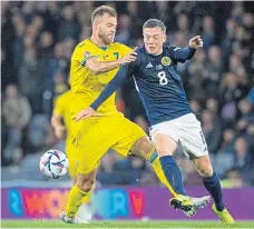  ?? ?? Callum Mcgregor up against Ukraine’s Andriy Yarmolenko last Wednesday night