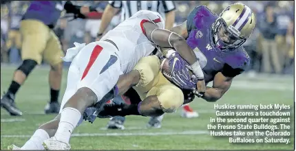  ?? GETTY IMAGES ?? Huskies running back Myles Gaskin scores a touchdown in the second quarter against the Fresno State Bulldogs. The Huskies take on the Colorado Buffaloes on Saturday.