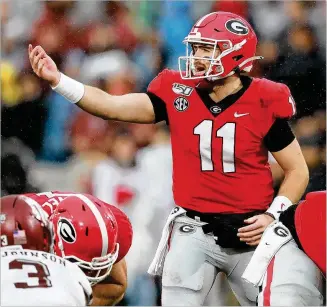  ?? CURTIS COMPTON / CCOMPTON@AJC.COM ?? For the third straight game, quarterbac­k Jake Fromm, who completed 70% of his passes through the first eight games, on Saturday completed less than half his attempts.