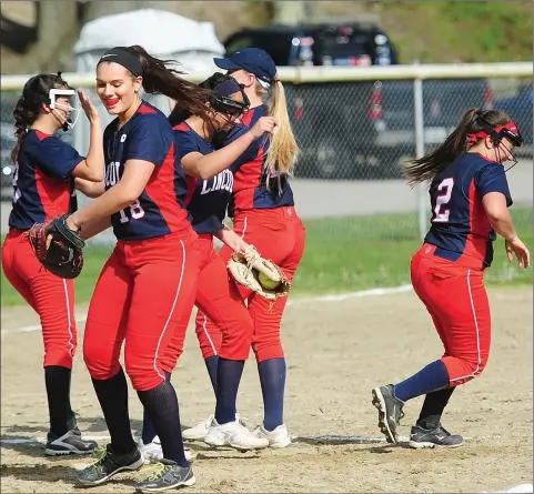  ?? Photos by Ernest A. Brown ?? Lincoln senior righty Bella DiOorio (above, center) helped her team snap a three-game losing streak Tuesday afternoon by striking out 14 Woonsocket batters in a 9-0 Division I victory. The Villa Novans had just three hits in the home defeat.