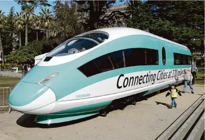  ?? Rich Pedroncell­i/Associated Press 2015 ?? A full-scale mock-up of a high-speed train at the Capitol in Sacramento. Cost overruns and delays hinder the project.