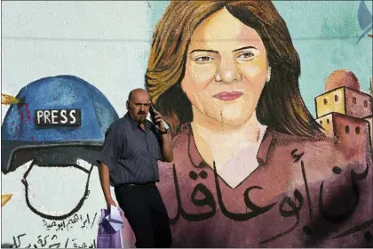 ?? ADEL HANA — THE ASSOCIATED PRESS ?? A mural of slain of Al Jazeera journalist Shireen Abu Akleh is on display, in Gaza City, Sunday, May 15, 2022. Abu Akleh was shot and killed while covering an Israeli raid in the occupied West Bank town of Jenin on May 11, 2022.