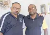  ?? PICTURE: LEON LESTRADE ?? Comforted by close family friend Visvin Reddy, Jonathan Shunmugum, right, stands near the spot where his wife’s lifeless body was found near a wall covered with family photos.