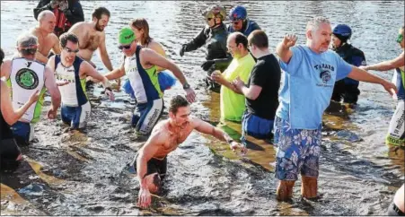  ?? TOM KELLY III — FOR DIGITAL FIRST MEDIA ?? Polar bear plungers complained the thick silt in the Schuylkill River made it difficult to jump in at Riverfront Park during the annual New Year’s Day celebratio­n in Pottstown Sunday.