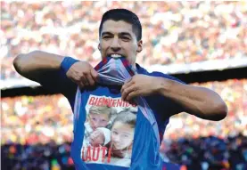  ??  ?? Barcelona forward Luis Suarez celebrates scoring his side’s second goal against Real Madrid Photo: AP