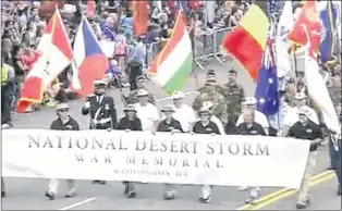  ?? SCREEN GRAB ?? Canadian Persian Gulf War Veterans march in Memorial Day parade in Washington DC wearing white shirts and hats.