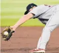  ?? AMIS/AP
JOHN ?? Red Sox shorstop Christian Arroyo catches a wild throw from catcher Kevin Plawecki during a game on Sept. 25 in Atlanta.