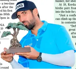  ?? SEAN M. HAFFEY/AGENCE FRANCE-PRESSE ?? FRENCHMAN Matthieu Pavon kisses the trophy after a historic conquest of the Farmers Insurance Open at Torrey Pines on Saturday.