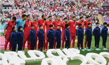  ?? Monday. Photograph: Matthias Hangst/Getty Images ?? Iranian players line up silently ahead of their World Cup match against England at Khalifa Internatio­nal stadium in Doha, Qatar, on