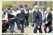  ??  ?? PROTECTED Theresa May on her visit to Grenfell Tower