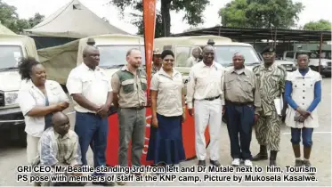  ??  ?? GRI CEO, Mr Beattie standing 3rd from left and Dr Mutale next to him, Tourism PS pose with members of staff at the KNP camp, Picture by Mukosela Kasalwe.