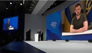  ?? ?? Ukraine's President Zelenskyy addresses leaders on the first day of the Davos summit