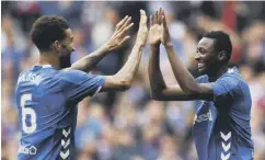  ??  ?? Connor Goldson, left, celebrates with goalscorer Umar Sadiq.