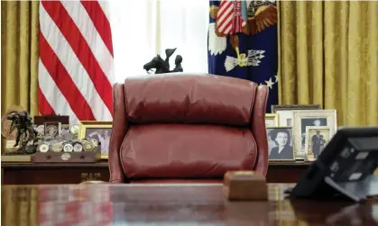  ?? ?? A chair sits empty behind the resolute desk in Washington DC on 3 December 2020. Photograph: Reuters/Alamy