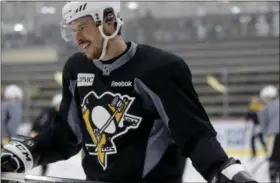  ?? KEITH SRAKOCIC — THE ASSOCIATED PRESS ?? Pittsburgh Penguins’ Sidney Crosby skates in warmups during hockey practice at the team training center in Cranberry, Pa., on Friday. The Penguins were scheduled to play the Nashville Predators in the third game of NHL Stanley Cup Finals in Nashville...